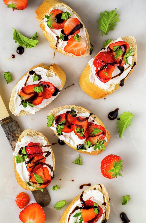 Slices Of Baguette With Strawberries, Basil, Balsamic Vinegar And Goats Cheese Photograph by Sandra Krimshandl-tauscher