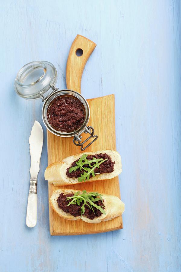 Slices Of Baguette With Tapenade And Rocket Photograph by Rua Castilho