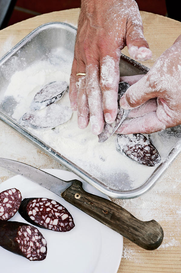 Meat Photograph - Slices Of Black Pudding Being Dusted In Flour by Torri Tre