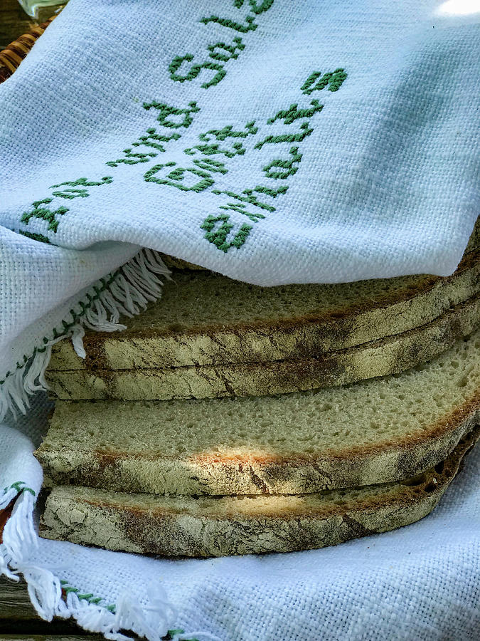 Slices Of Bread In A Linen Cloth Photograph by Eising Studio