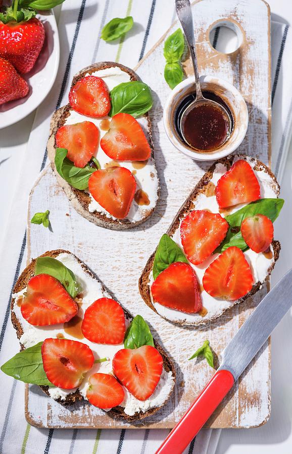Slices Of Bread Topped With Cream Cheese, Strawberries, Balsamic Vinegar And Basil Photograph by Komar