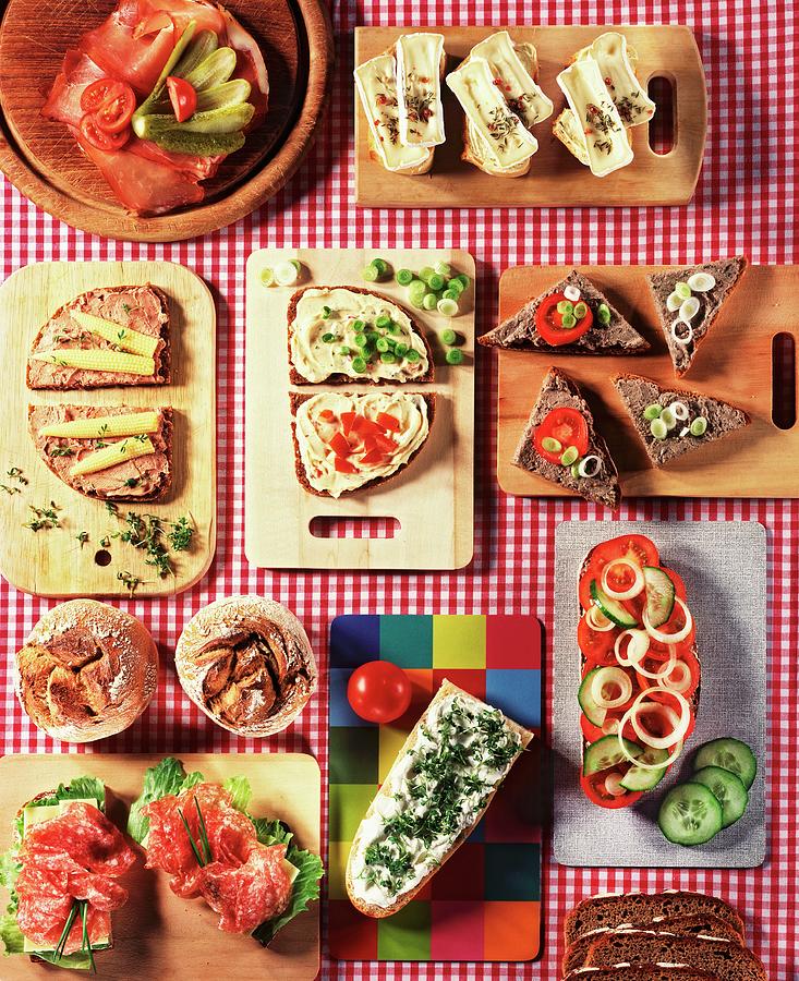 Slices Of Bread With Various Toppings On Small Boards Photograph by Landler/keppler