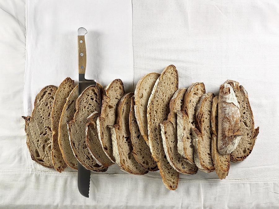 Slices Of Brown Bread Made From Mixed Rye And Wheat Flour, Lined Up Together Photograph by Ellert, Luzia