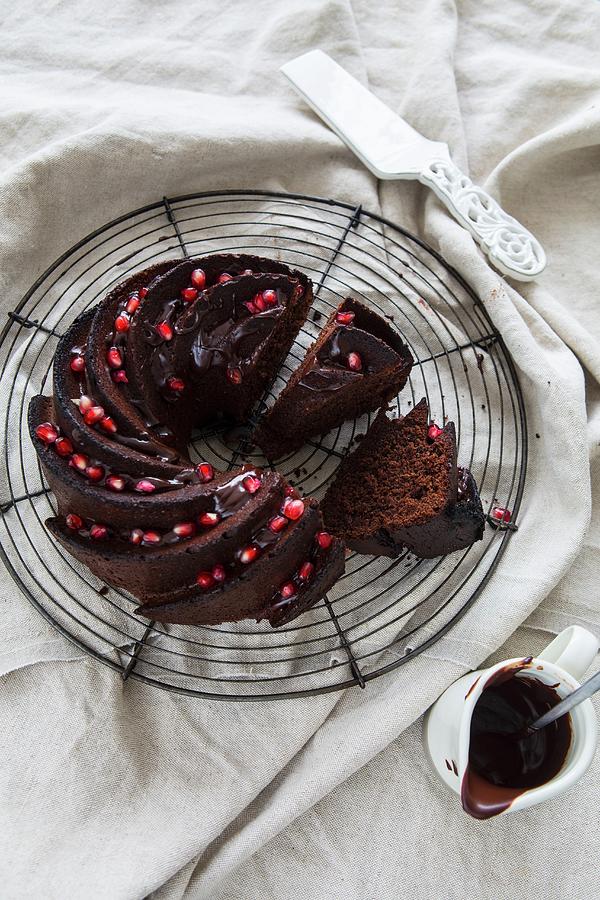 Slices Of Chocolate Bundt Cake Garnished With Pomegranate Seeds Photograph by Aniko Takacs