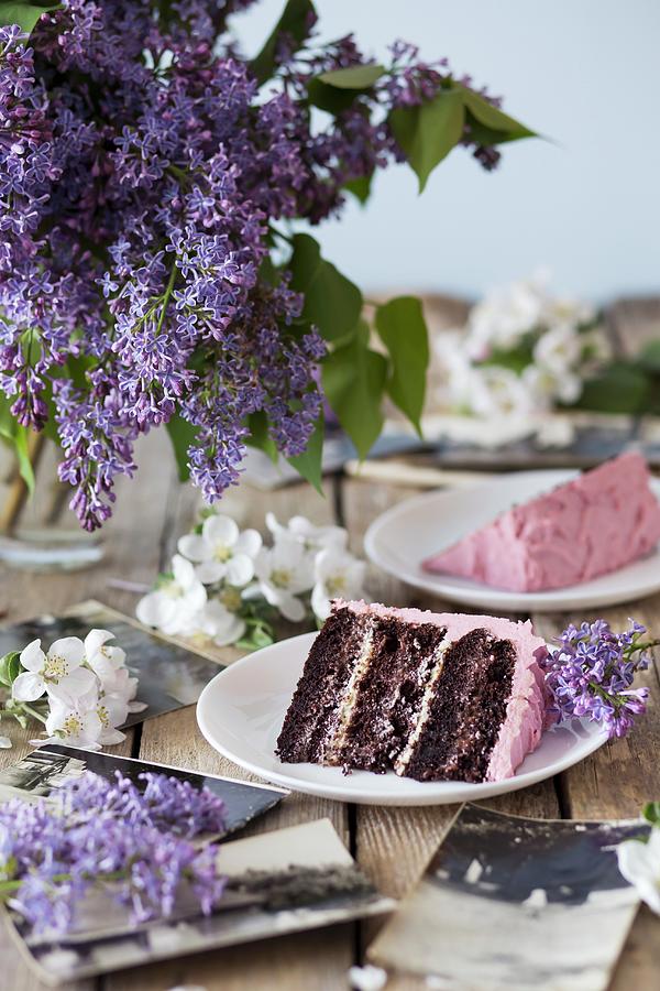 Slices Of Chocolate Cake With Raspberry Cream On Plates Photograph by Malgorzata Laniak