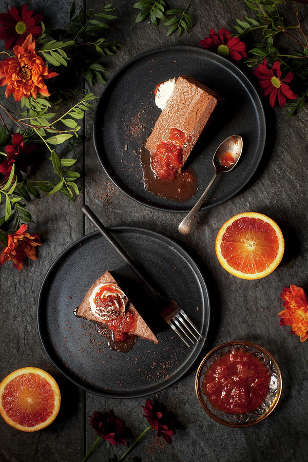 Slices Of Chocolate Mousse Cake With Blood Orange Compote Photograph by Jane Saunders