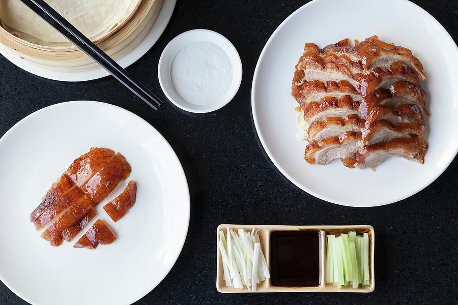 Slices Of Crispy Peking Duck And Duck Skin With Pancakes Spring Onions Cucumber And Hoisin Sauce Photograph by Sarah Coghill