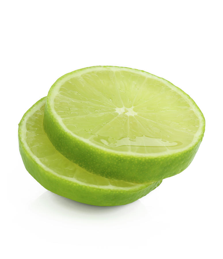 Still Life Photograph - Slices Of Fresh, Juicy, Freshly Cut Lime by Rosemary Calvert