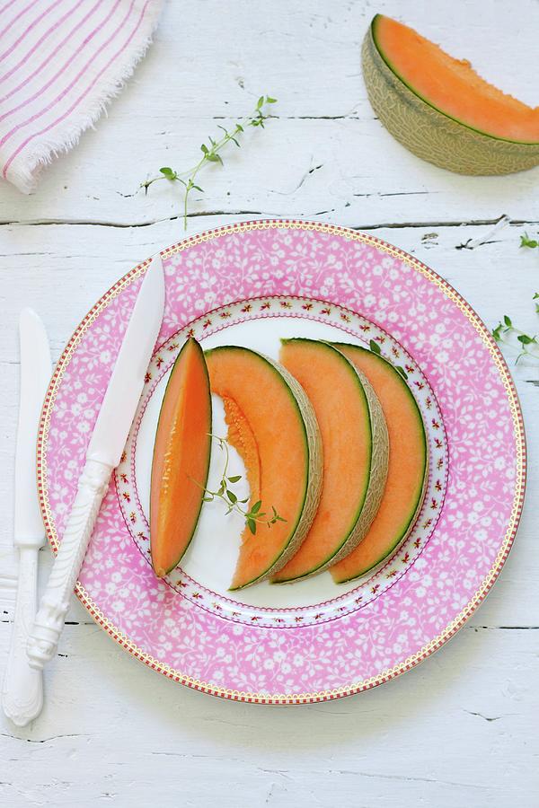 Slices Of Fresh Melon On A Plate Photograph by Silvia Palma Photography