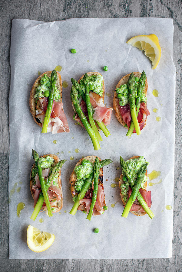Slices Of Grilled Ciabatta With Crushed Peas, Ham And Asparagus Photograph by Magdalena Hendey