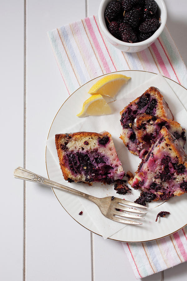 Slices Of Mulberry Yoghurt Bread With Lemon Glaze Photograph by Katharine Pollak