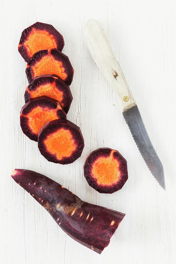 Slices Of Purple Carrot Photograph by Eva Grndemann