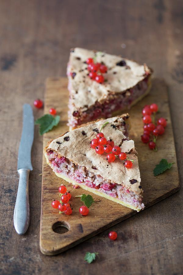 Slices Of Redcurrant & Almond Tart On A Wooden Cutting Board Photograph by Malgorzata Laniak