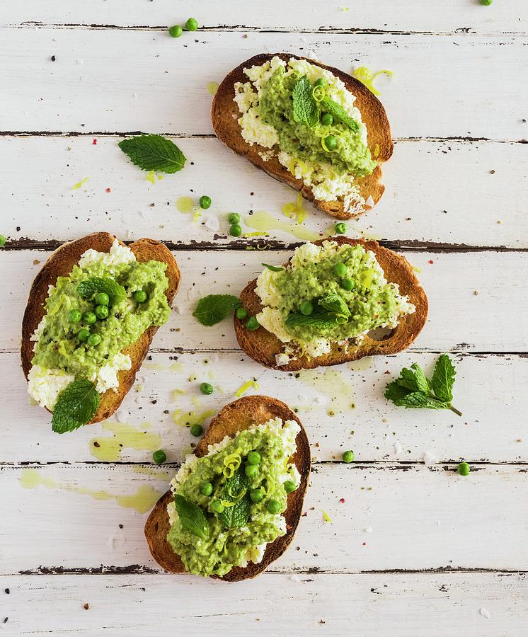 Slices Of Toasted Bread With A Pea Spread Photograph by Hein Van Tonder