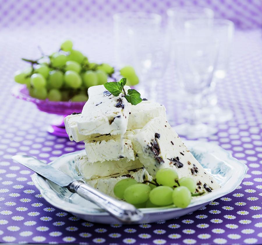Slices Of Vanilla Parfait With Dark Chocolate Served With Green Grapes Photograph by Mikkel Adsbl