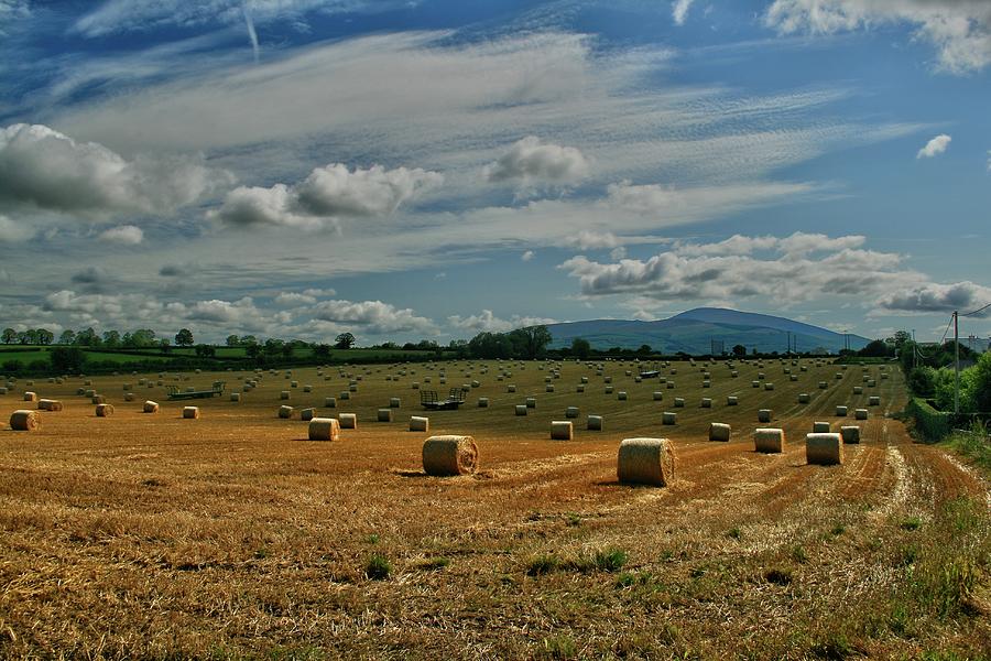 Slievenamon Behind The Bales Of Straw Photograph by John Carey 2011