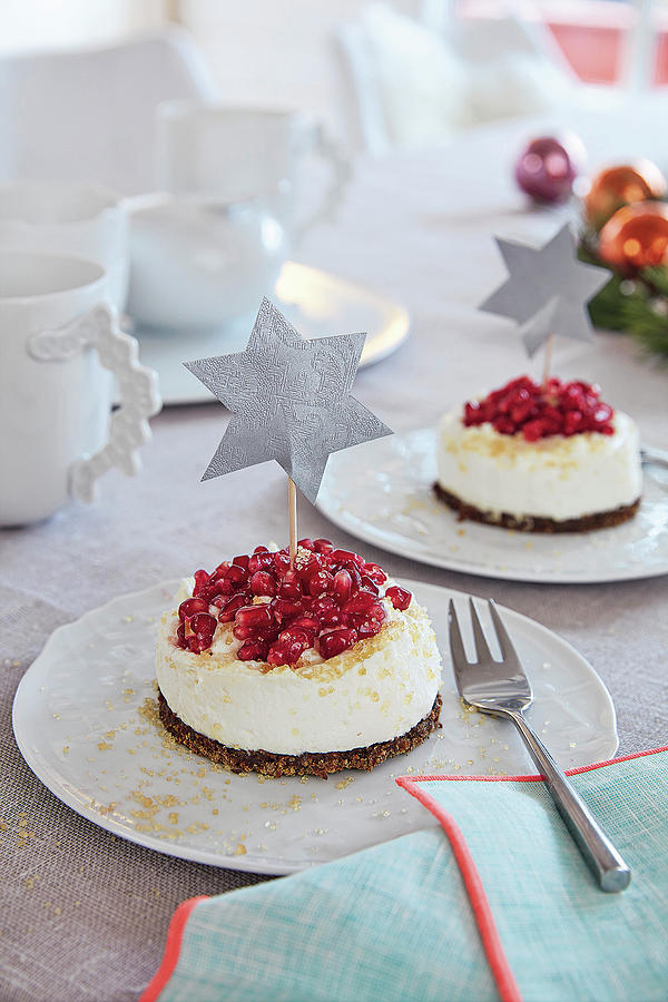 Small Advent Cakes With Pumpernickel And Pomegranate Seeds On A Table Photograph by Jalag / Olaf Szczepaniak