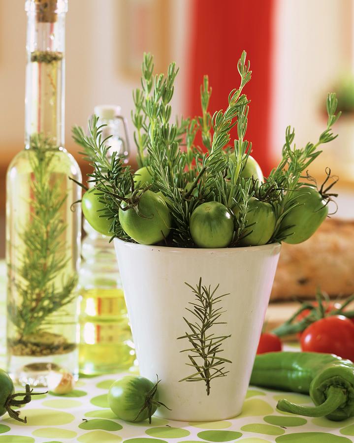 Small Arrangement Of Rosemary And Green Tomatoes Photograph by Strauss, Friedrich