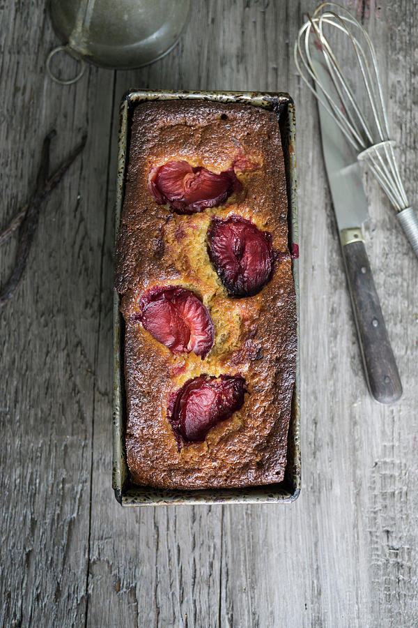 Small Banana Cake With Prunes Photograph by Martina Schindler