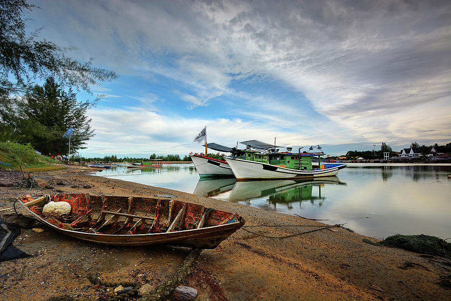 Small Boat Stranded At The Base Photograph by Tuah Roslan
