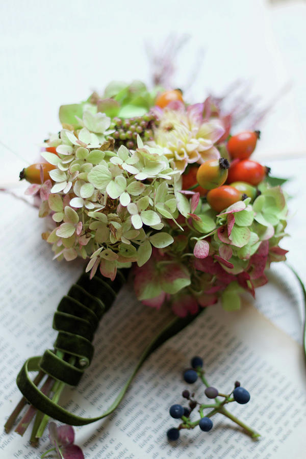 Small Bouquet Made Of Hydrangea Flowers, Rose Hips And Dahlia Photograph by Hilda Hornbachner