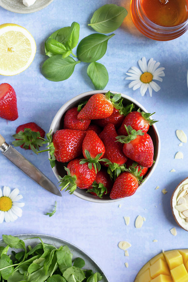Small Bowl Of Fresh Strawberries On A Vibrant Background Photograph by Anna Wierzbinska