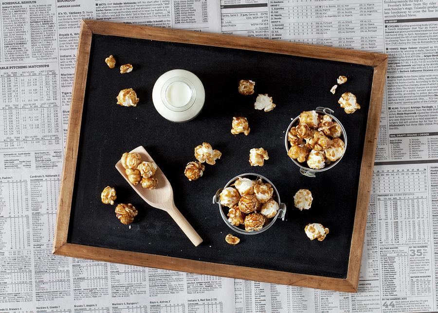 Small Buckets Of Caramel Popcorn And Milk On A Blackboard Photograph by Jane Saunders
