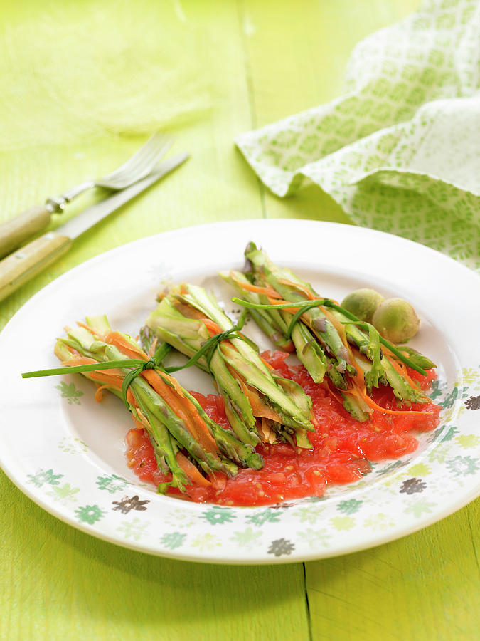 Small Bundles Of Sliced Asparagus And Carrots With Tomato Sauce Photograph by Lawton
