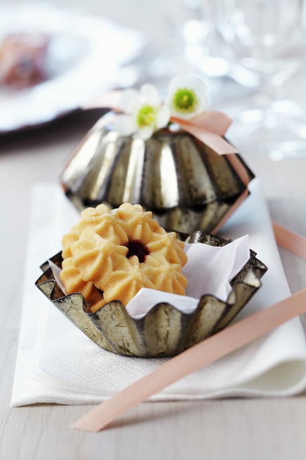 Small Cake Moulds Filled With Biscuits As Guest Favours Photograph by Franziska Taube
