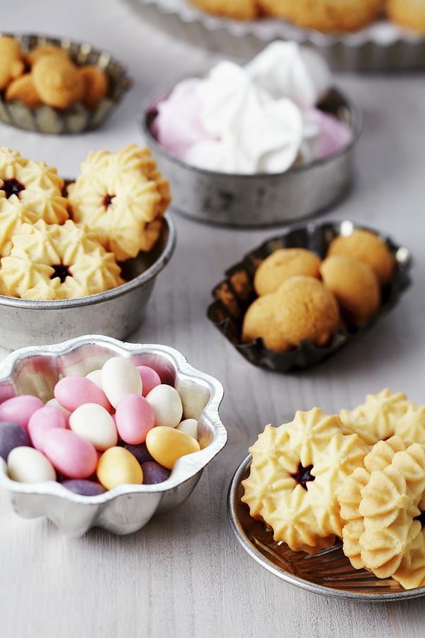 Small Cake Moulds Used As Dishes For Biscuits, Sugar Eggs, Meringues & Amarettini Macaroons Photograph by Franziska Taube
