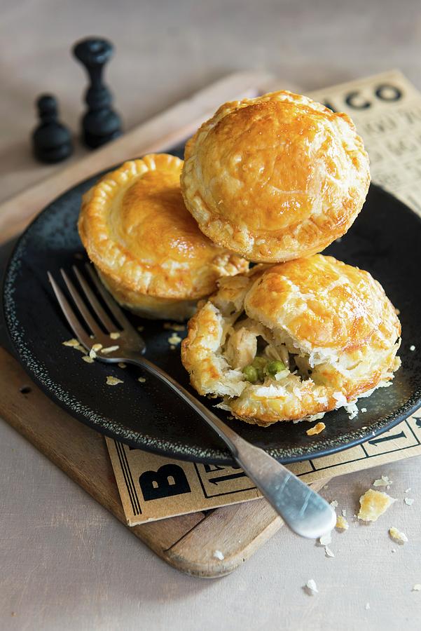 Small Chicken Pies For Game Night Photograph by Veronika Studer