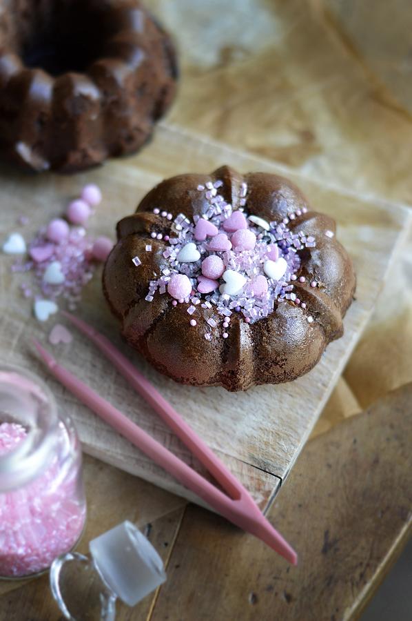 Small Chocolate Cake With A Pink Decoration Photograph by Keroudan