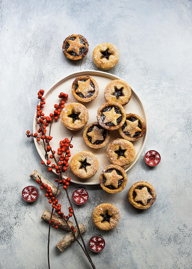 Small Christmas Mince Pies Decorated With Berry Branches And Tealights Photograph by Lisa Rees
