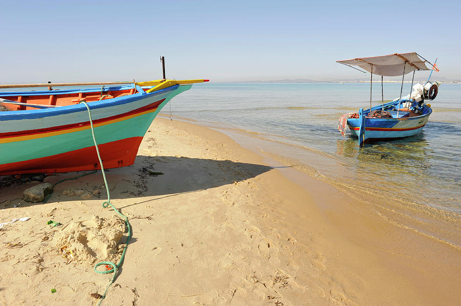 Small Colorful Fishing Boats On Shore Photograph by Majaiva