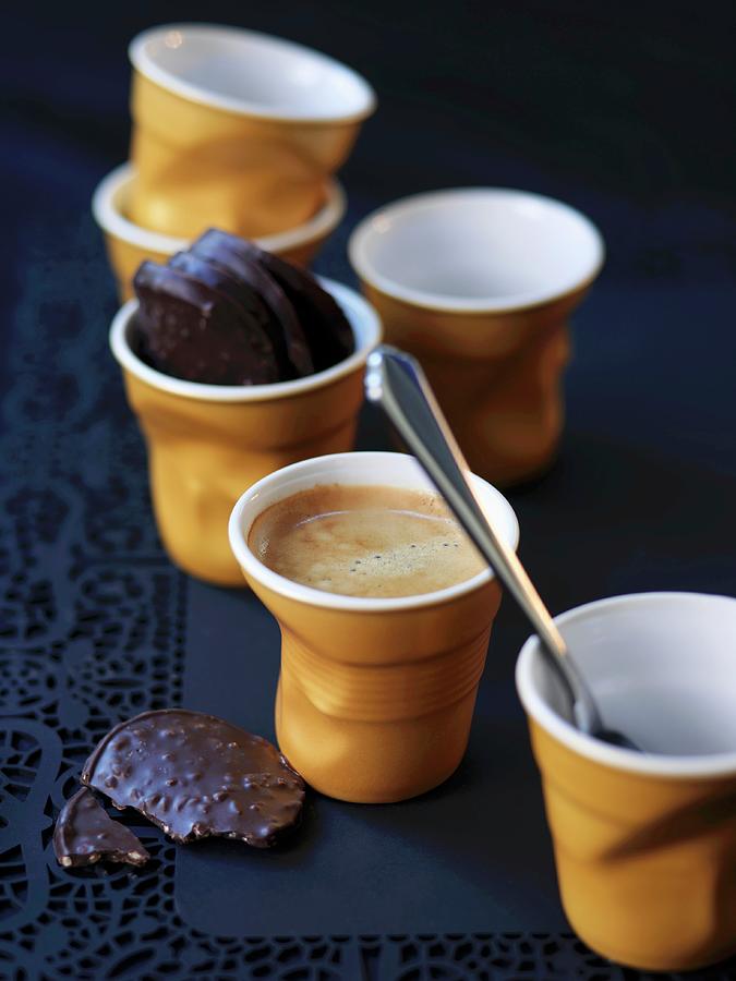 Small Cups Of Coffee And Chocolats Photograph by Hall