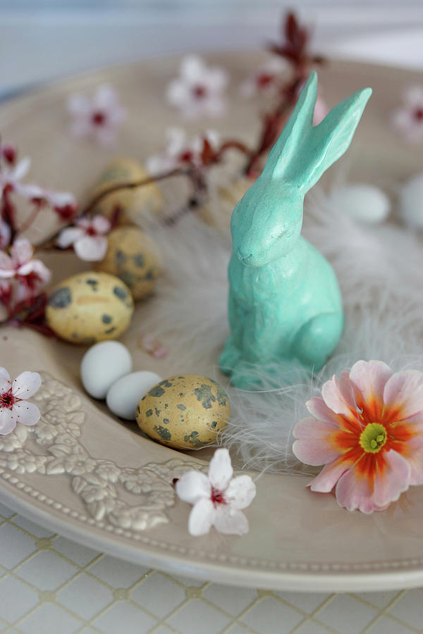 Small Easter Arrangement Of Easter Bunny, Easter Eggs, Primula Flowers And Branch Of Flowering Plum Photograph by Angelica Linnhoff