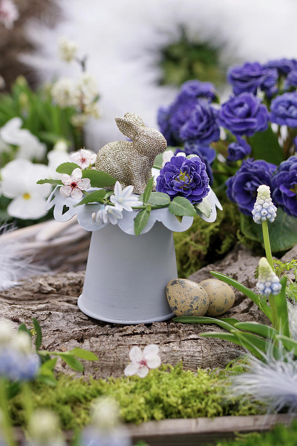 Small Easter Decoration With Flowers Of Filled Primrose, Pushkinia, Cherry Plum Blossoms, And Grape Hyacinth, Easter Bunny, And Easter Eggs Photograph by Angelica Linnhoff