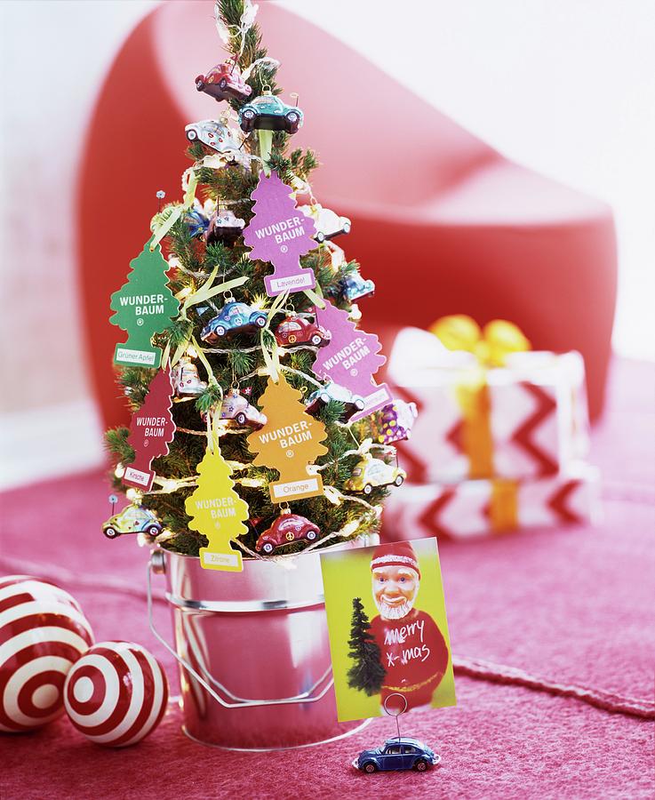 Small Fir Tree Decorated With Magic Tree Air Fresheners And Car-shaped Baubles Photograph by Matteo Manduzio