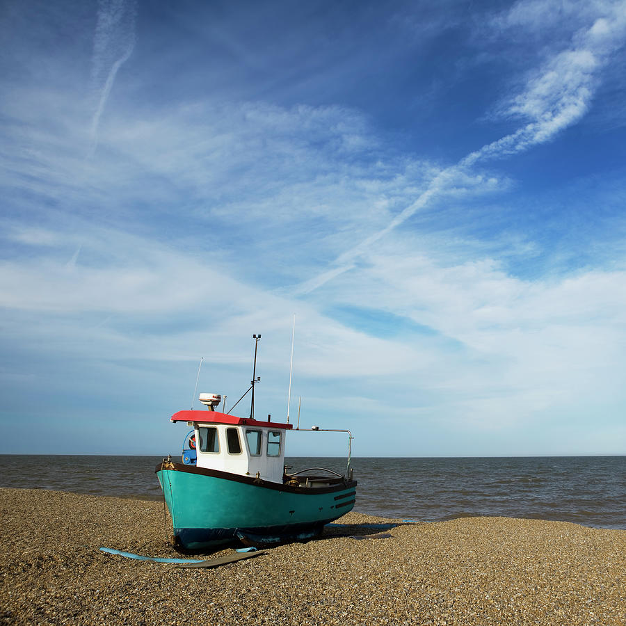 Small Fishing Boat On Shore, Uk by Roine Magnusson