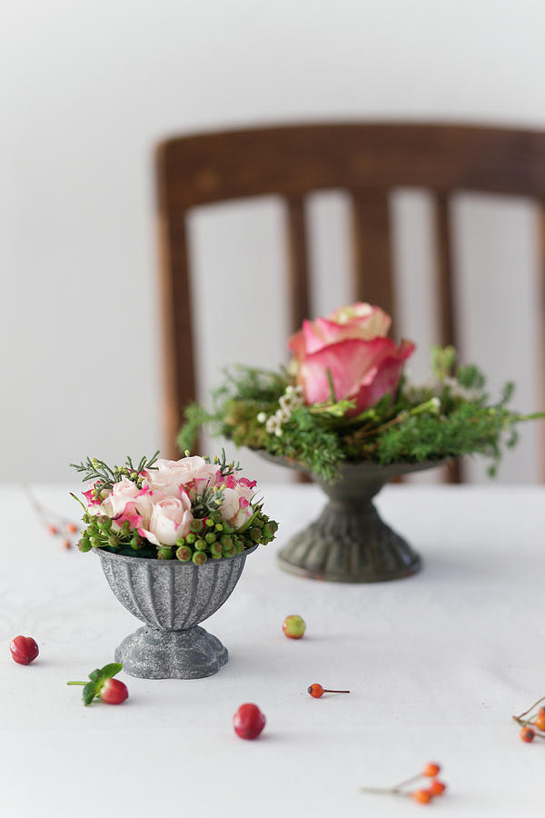 Small Flower Arrangements In Grey Metal Bowls On Table Photograph by Iris Wolf