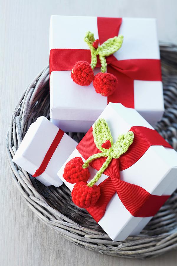 Small Gift Boxes Decorated With Red Ribbons And Crocheted Cherries Photograph by Franziska Taube