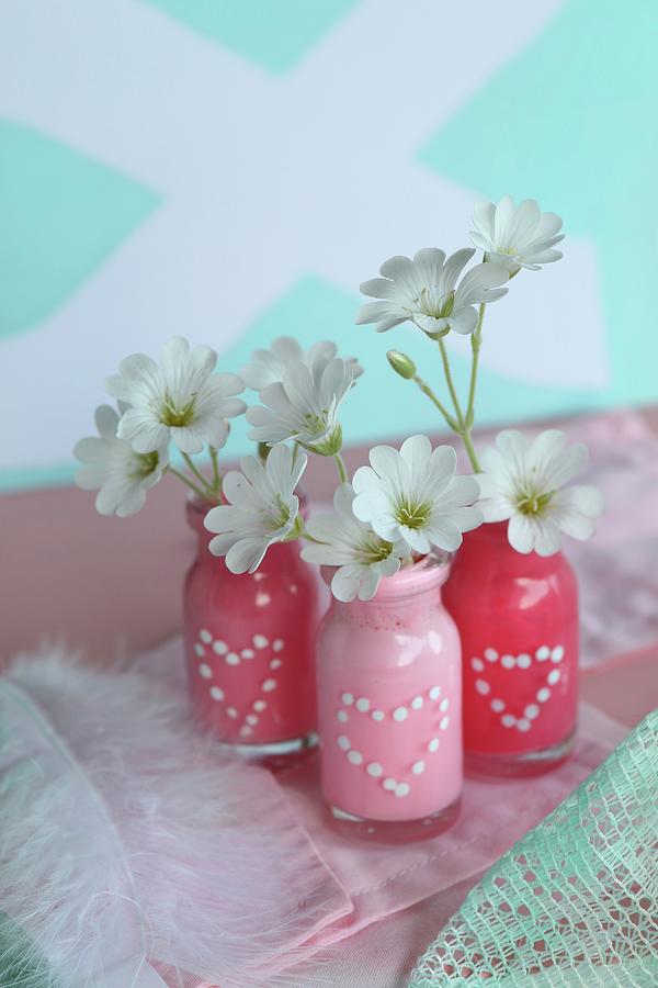 Small Glass Bottles Painted With Polka-dot Hearts Used As Vases Photograph by Regina Hippel