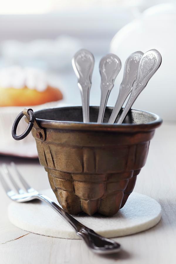 Small Jelly Mould Used As Cutlery Caddy For Buffet Photograph by Franziska Taube