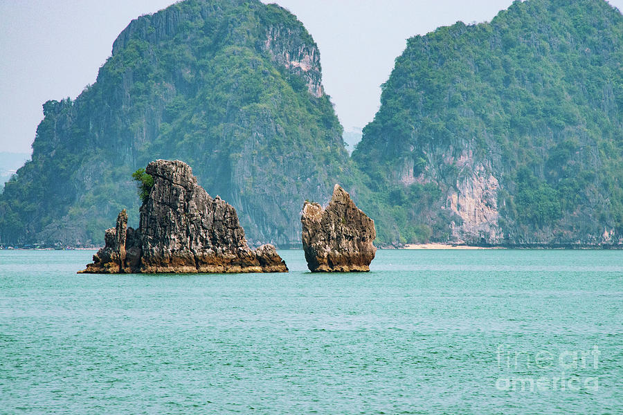 Small Limestone Isles in Halong Bay One Photograph by Bob Phillips