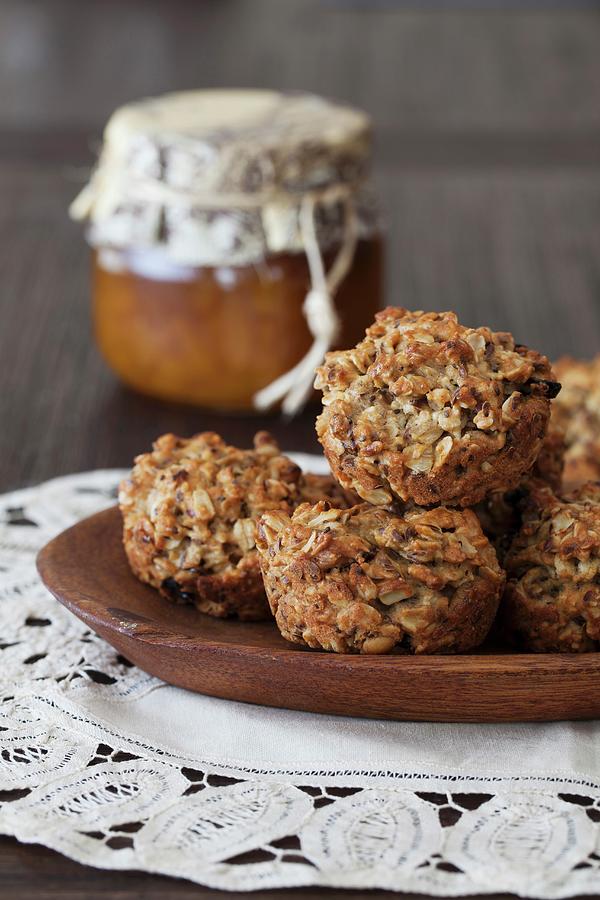 Small Oat Breakfast Cakes With Seeds, Cashew Nuts & Dried Berries Photograph by Yelena Strokin