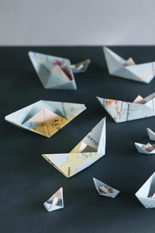 Small Paper Boats Made From Folded Maps Photograph by Regina Hippel