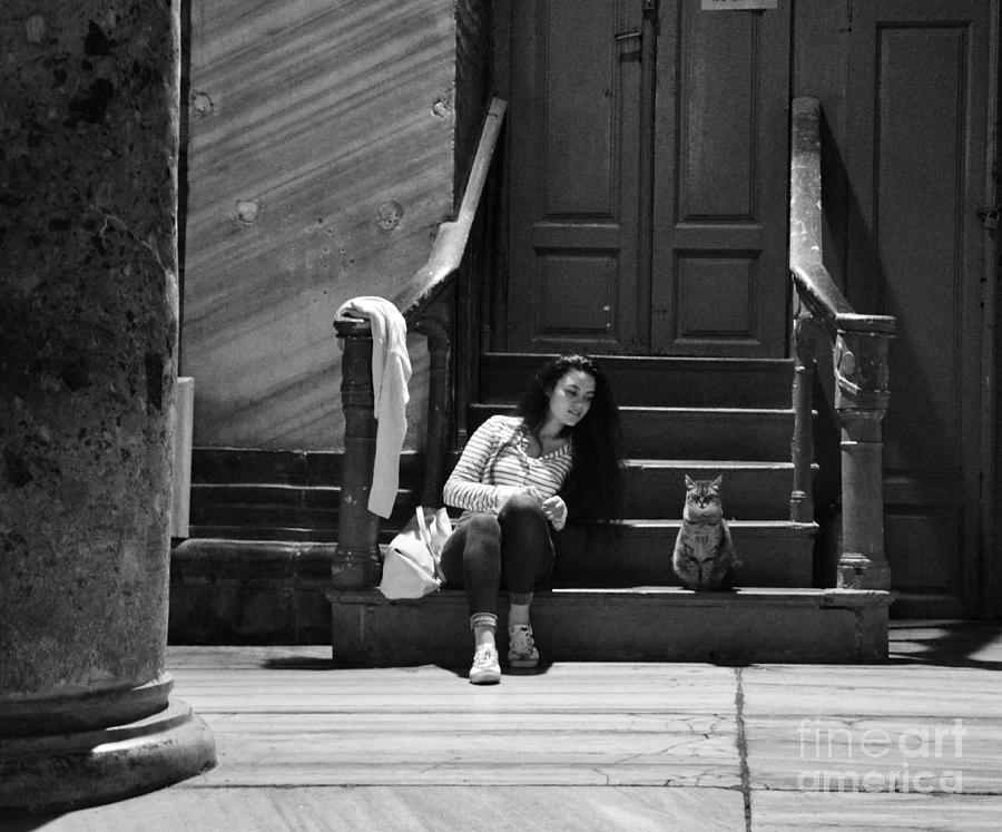 Small talk between girl and cat - Black and white Photograph by Yavor Mihaylov
