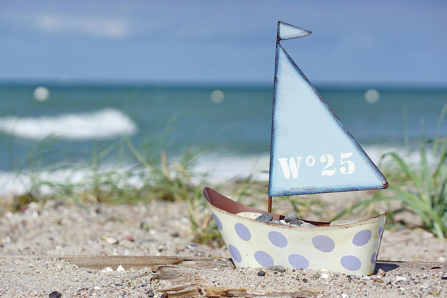 Small Toy Sailing Boat On Beach Photograph by Angelica Linnhoff