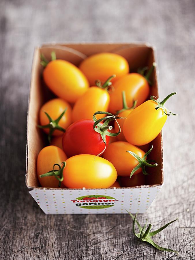 Small Yellow Tomatoes In A Cardboard Box Photograph By Brachat Oliver   Small Yellow Tomatoes In A Cardboard Box Brachat Oliver 