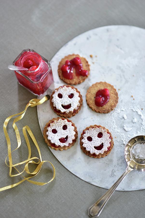 Smiley Cookies With Cranberry Jam Photograph by Tanja Major